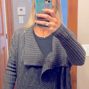 Gray sweater with snap closures
